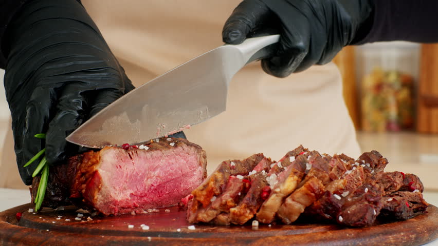 Preparing a healthy steak dish in the kitchen with a skilled chef