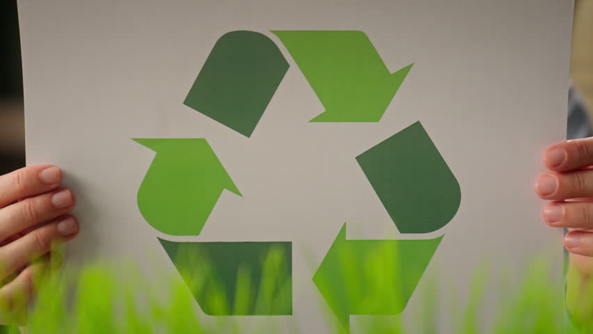 Recyclable symbol holding unrecognizable businesswoman girl woman in office eco-friendly business circle sorting paper protect ecology recycling saving nature reuse zero waste green energy bio recycle