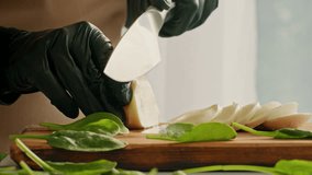 Expert chef slicing fresh vegetables on a wooden cutting board for healthy meals - Powered by Shutterstock - Get 15% off with code: PIKWIZARD15