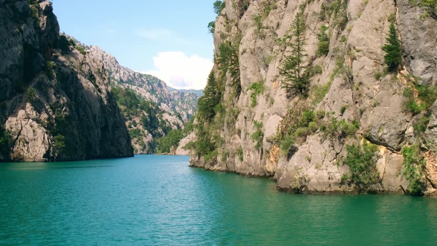 Panoramic Landscape view on green canyon Antalya Turkey with turquoise water mountain cliffs and green forest. Showcasing natural beauty travel tourist destination. Vacation concept