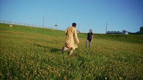 Vibrant yellow meadow setting showcasing heartwarming reunion between traditionally dressed indian couple, running and embracing with deep emotional connection and pure joy - Powered by Shutterstock - Get 15% off with code: PIKWIZARD15
