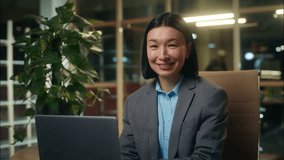 Happy Asian Korean Chinese Japanese woman typing laptop working online female looking at camera smiling girl businesswoman business employee office indoor portrait leader manager computer e-commerce - Powered by Shutterstock - Get 15% off with code: PIKWIZARD15