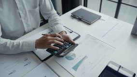 Male Accountant Reviewing Financial Documents with Calculator - Powered by Shutterstock - Get 15% off with code: PIKWIZARD15