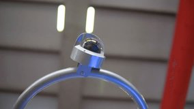 Security camera mounted on a crane, observing a public space - Powered by Shutterstock - Get 15% off with code: PIKWIZARD15