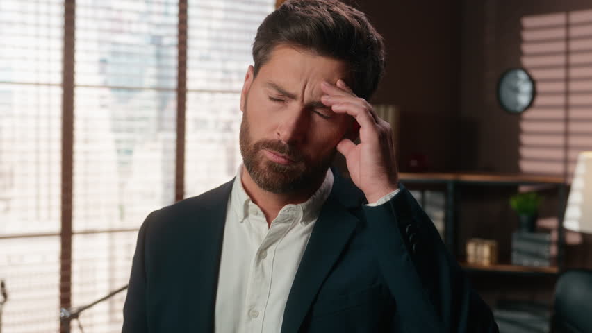 Portrait in office thinking business middle-aged Caucasian man businessman worker feeling bad unwell sick suffer head pressure pain migraine headache medicine health problem need painkiller male guy