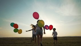 Children holding balloons outdoors. Children celebrating birthday with balloons. Friendship fun with balloons on birthday. children enjoying birthday outdoors. Balloons adding fun children friendship. - Powered by Shutterstock - Get 15% off with code: PIKWIZARD15