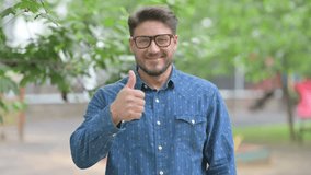 Middle Aged Man Giving Thumbs Up Outdoors - Powered by Shutterstock - Get 15% off with code: PIKWIZARD15