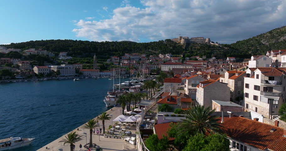 Waterfront Town Of Hvar And Promenade In Hvar Island, Croatia. - aerial shot