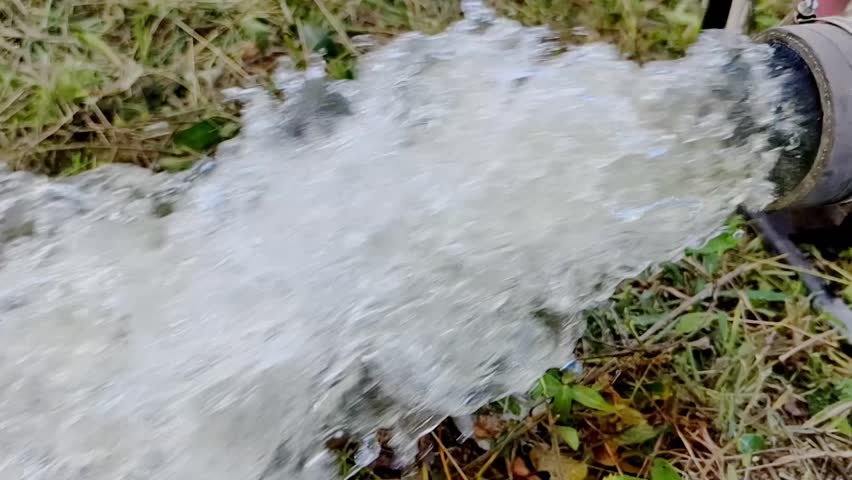Water Fountain Flow: A close-up shot of water gushing powerfully from a pipe, creating a dynamic display of motion and force, highlighting the fluidity and energy of the life-giving resource.