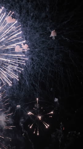 Vertical aerial in front of fireworks at Terreiro do Paço, New Year in Lisbon
