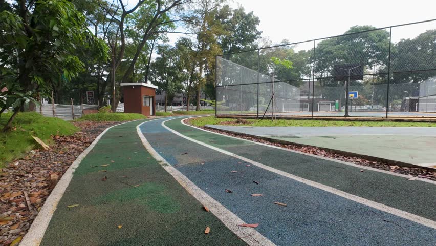 Walking on Outdoor Track in Public Park Recreation Area Low Angle