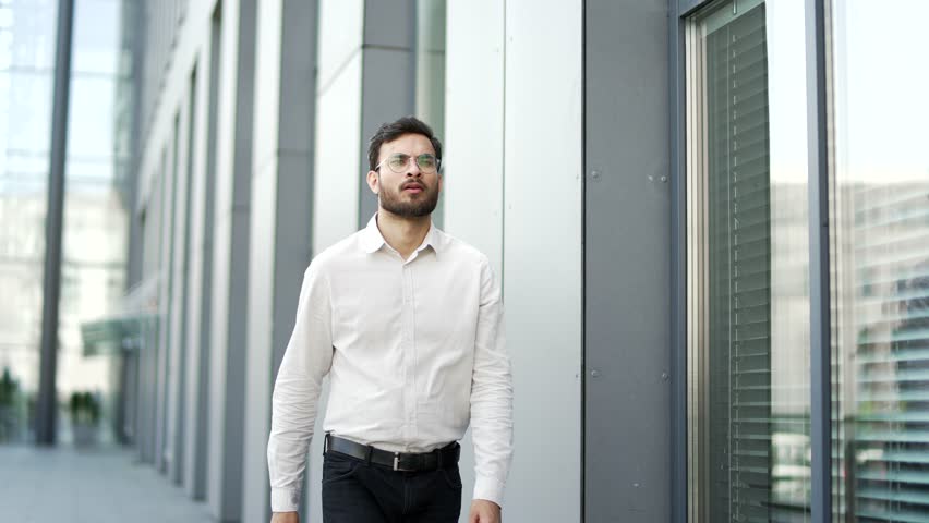 Businessman has heart attack, suffering from chest tension walking on street near office building. Upset unhealthy man holding sore spot with hands, breathing deeply, needs urgent medical attention