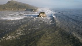 Swell Crashing Against The Islet Near The Rapahoe Beach In South Island, New Zealand. - aerial shot - Powered by Shutterstock - Get 15% off with code: PIKWIZARD15