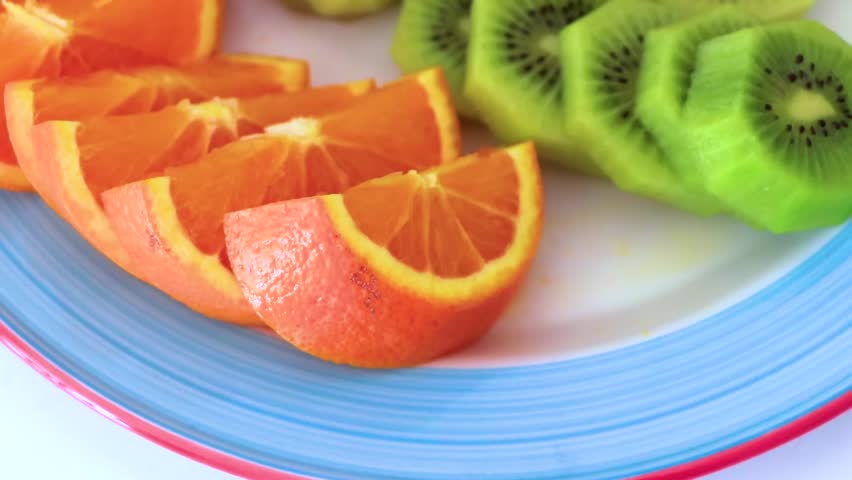 Sliced oranges kiwi and bananas on a plate in the Alps Fließ Landeck Tyrol Austria.