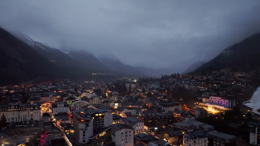 City lights of Chamonix illuminating the French Alps at dusk, creating a magical atmosphere in the valley of a luxury tourist destination