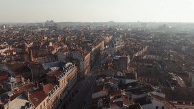 Aerial perspective capturing Toulouse urban landscape, terracotta rooftops illuminating historic center under warm dawn radiance - Powered by Shutterstock - Get 15% off with code: PIKWIZARD15