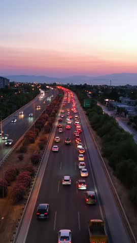 Vehicles on the highway in Izmir - 4k aerial view of vehicles driving on the highway in the evening, taken from the air with a drone