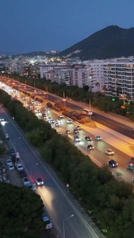 Vehicles on the highway in Izmir - 4k aerial view of vehicles driving on the highway in the evening, taken from the air with a drone