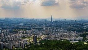 A wide-angle panning timelapse sweeps across the immense cityscape of Seoul, South Korea, revealing the sprawling urban landscape with the famous Lotte World Tower at its heart. - Powered by Shutterstock - Get 15% off with code: PIKWIZARD15