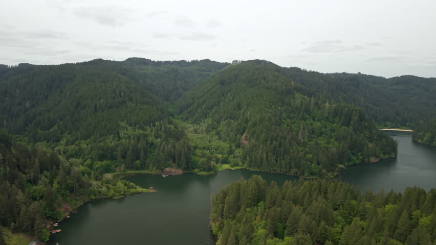 Aerial of Loon Lake, Oregon. Drone flight on overcast day over scenic Oregon landscape.