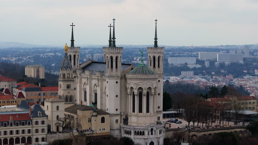 Aerial view of the Basilica of Notre Dame de Fourviere and metallic television tower of Fourviere in Lyon, Southern France