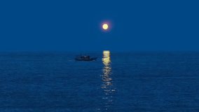 Full moon rising over the ocean with a small boat sailing under its glow, creating a shimmering golden reflection on the water. A peaceful maritime night scene symbolizing calm, adventure, and nature’ - Powered by Shutterstock - Get 15% off with code: PIKWIZARD15