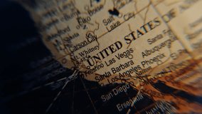 United States of America marked on globe macro view. Old retro world map model showing geographical objects closeup. USA country territory illustrated on planet sphere surface. Geography education. - Powered by Shutterstock - Get 15% off with code: PIKWIZARD15