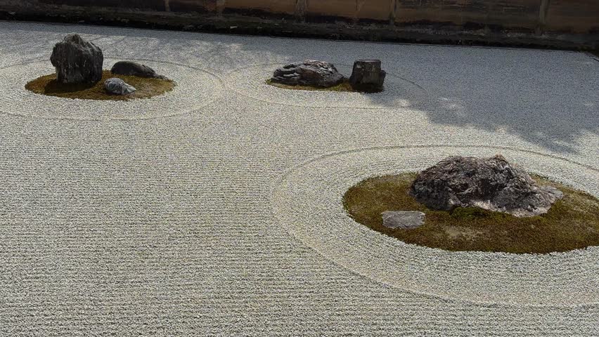Serene Zen garden with raked gravel, carefully placed rocks, and patches of moss. A minimalist landscape design, evoking tranquility and peace. Ideal for meditation or relaxation imagery.