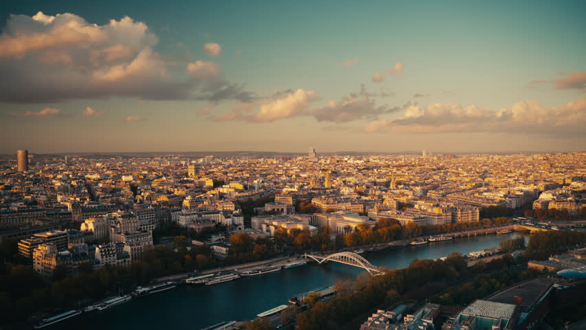 Scenic panoramic view of Paris and Seine River at golden sunset