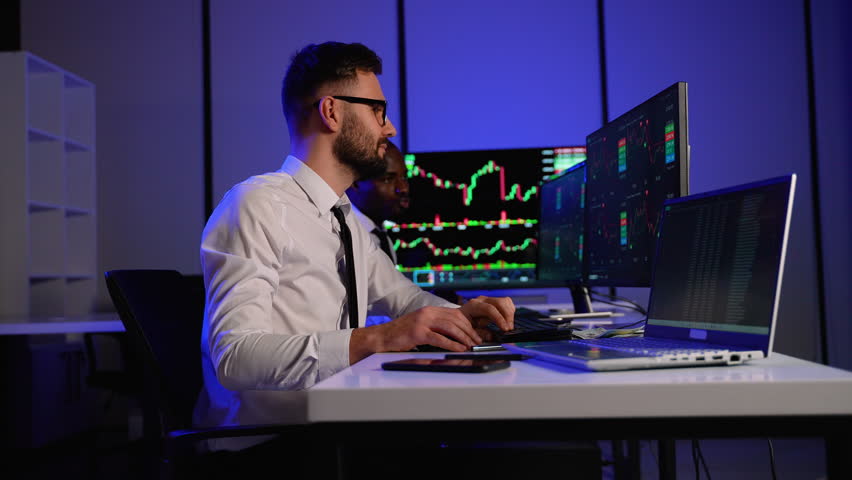 Two traders celebrating stock market price increase