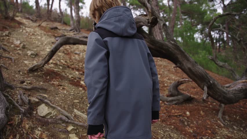 Backpack Equipped Hiker Climbing Steep Forest Trail After Rain