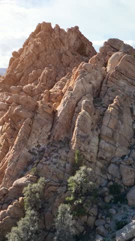 Aerial shot of interesting rock formations in the desert north of Bishop California. Vertical Video.