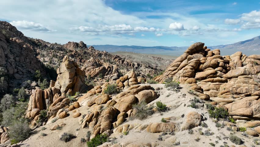 Aerial shot of interesting rock formations in the desert north of Bishop California