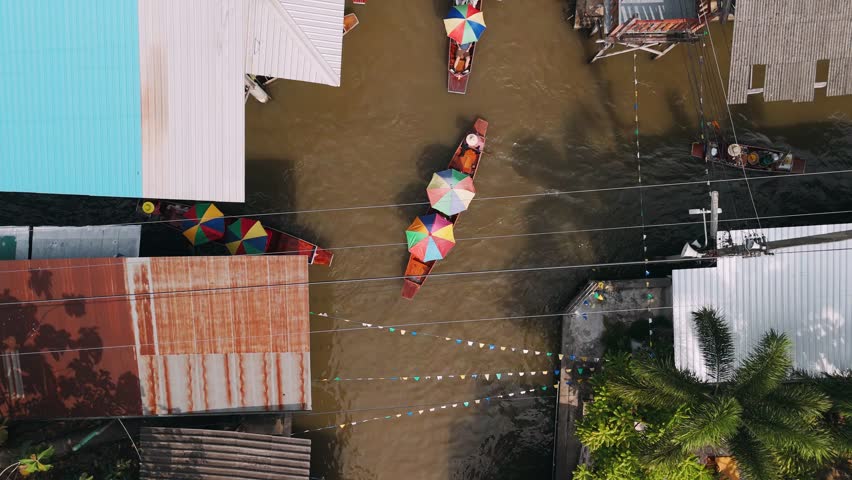 Aerial view of Damnoen Saduak Floating Market with colorful longtail boats in Thailand