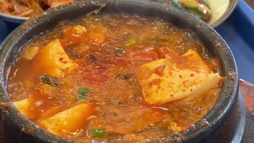 Hot boiling Korean spicy soft tofu stew, Sundubu jjigae