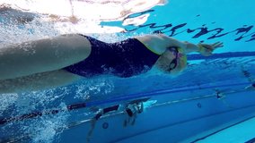 Swimmer girl dives into the water at the start in the pool. - Powered by Shutterstock - Get 15% off with code: PIKWIZARD15