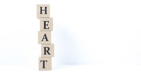 A block with a heart symbol written on it. White background. - Powered by Shutterstock - Get 15% off with code: PIKWIZARD15