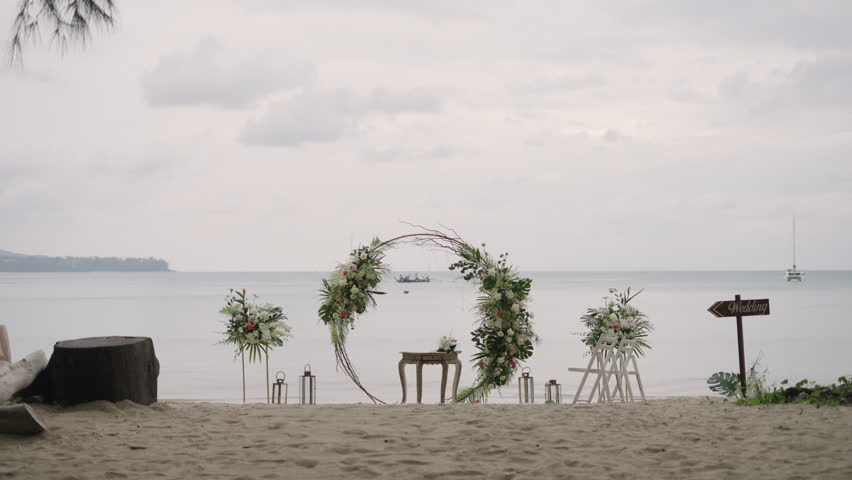 wedding western beach ceremony set up. wedding decor floral arch detail.