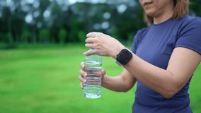 Woman is drinking water from a bottle after running - Powered by Shutterstock - Get 15% off with code: PIKWIZARD15