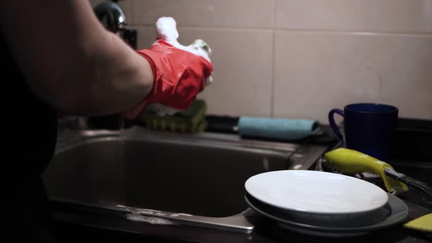 Man Washing Dishes in the Kitchen — Household Cleaning and Kitchen Routine