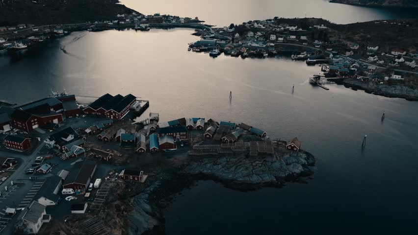 Reine, Lofoten Islands, Nordland, Norway - Wooden Cabins Overlooking the Calm Waters of the Fishing Village - Aerial Ascend Shot