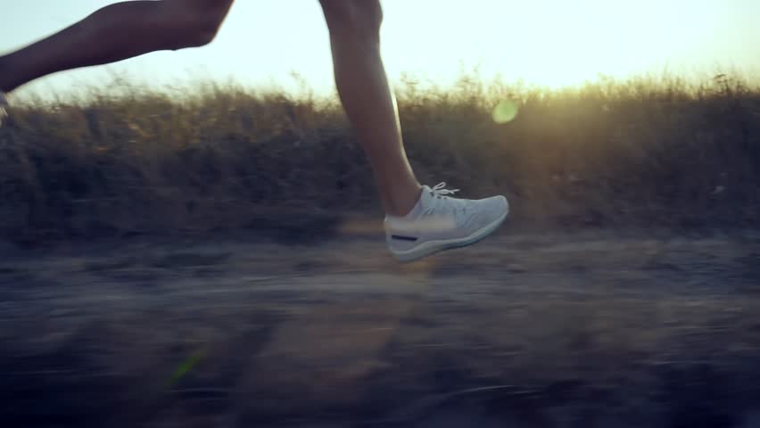 professional runner training sport high intensive interval running. runner's legs in motion during early morning jog on a rural trail at sunrise. Fitness lifestyle sport running, outdoor workout, sport healthy living. endurance sport. Endurance Exercising. Runner Fitness Activity. Jogger Muscular Exercising For Running. Difficult Skills. Professional Runner Fitness Exercising. Running In City