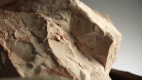 Macro clip of angular beige stone with red mineral details - Powered by Shutterstock - Get 15% off with code: PIKWIZARD15