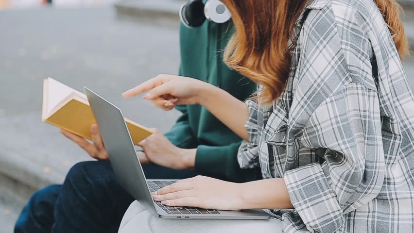 Full concentration at work. Group of young business people working and communicating while sitting at the office desk together with colleagues sitting in the backgroun Video