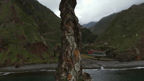 Rocky Coast And Islet Of Ribeira da Janela With Overcast Sky In Madeira, Portugal. pullback drone shot - Powered by Shutterstock - Get 15% off with code: PIKWIZARD15