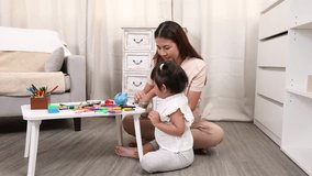 Asian little girl preschool kid learning saving put a coin into piggy bank by mother teaching, creating a playful and educational moment of family bonding and early financial education development - Powered by Shutterstock - Get 15% off with code: PIKWIZARD15