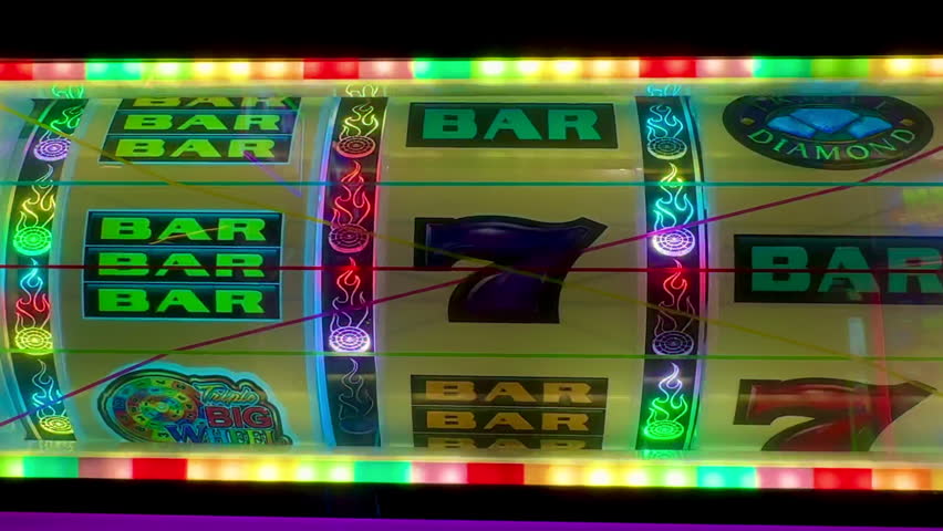 Spinning slot machine 777, flashing lights, betting, gambling, casino floor