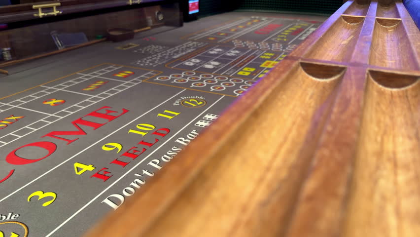 Craps table and rail for chips on cruise ship, betting and gambling with dice