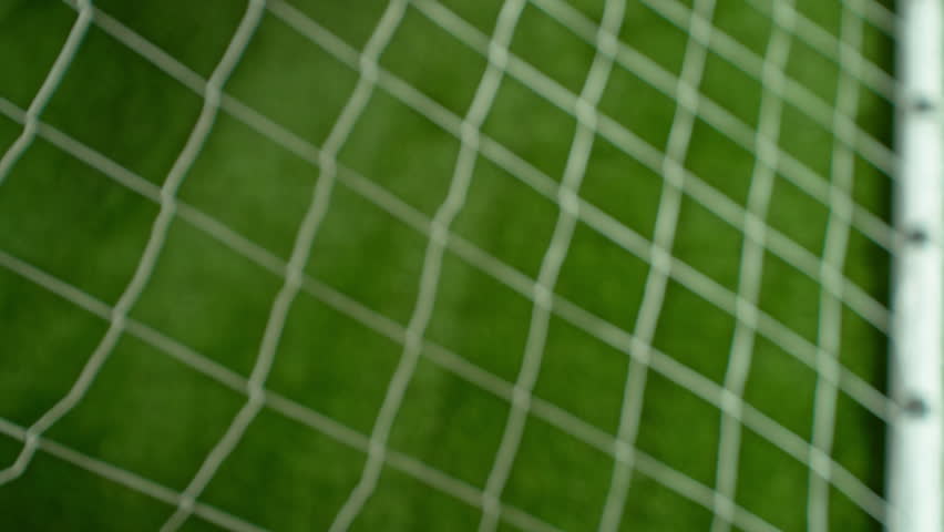Super Slow Motion Soccer Ball Hitting Goal Net on Green Field, 1000fps.