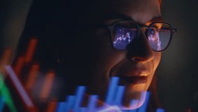 Late evening female trader studying graphs wearing glasses watching laptop display closeup. Happy digital currency expert managing bitcoin charts focused on financial analysis solo in office space - Powered by Shutterstock - Get 15% off with code: PIKWIZARD15